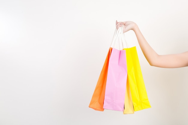 Portrait of happy smiling woman hold shopping bag