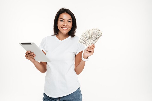 Portrait of a happy smiling woman holding tablet computer