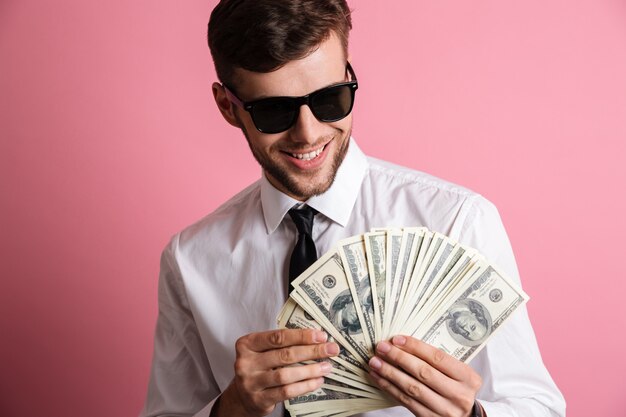 Portrait of a happy successful man in sunglasses