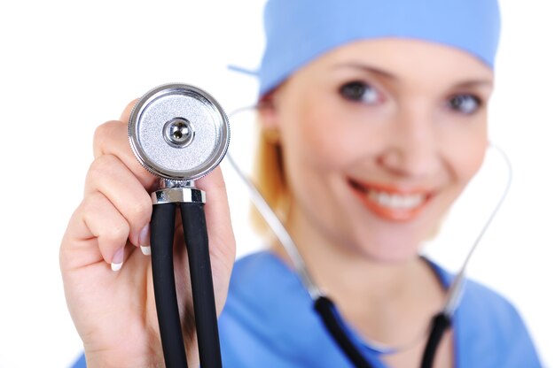 Portrait of happy surgeon with stethoscope  - isolated on white