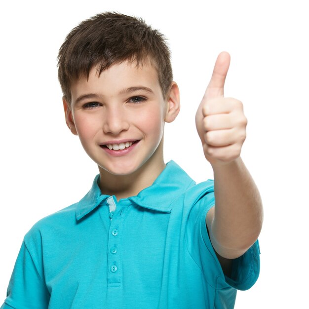 Portrait of happy teen boy showing thumbs up gesture