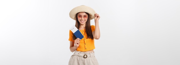 Portrait of happy tourist woman holding passport on holiday on white background