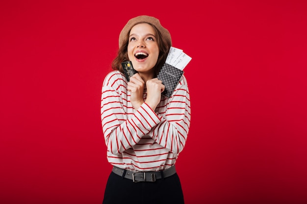 Portrait of a happy woman holding passport