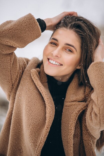 Portrait of a happy woman in winter outside