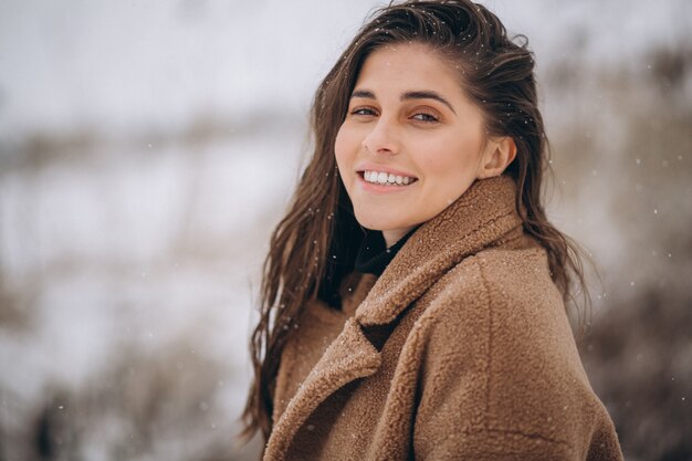 Portrait of a happy woman in winter outside