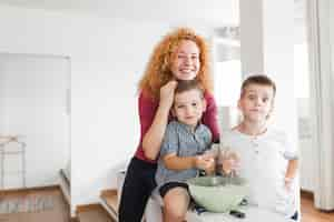 Free photo portrait of happy woman with her two children