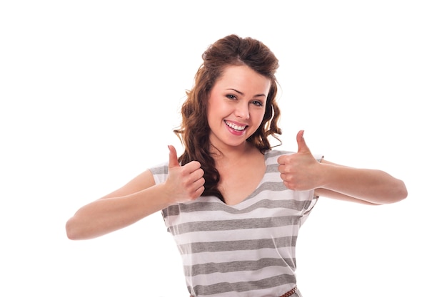 Portrait of happy woman with thumbs up
