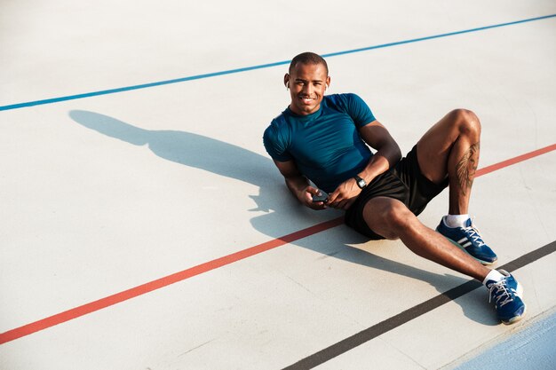 Portrait of a happy young african fitness man