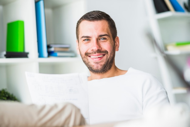 Portrait of a happy young businessman looking at camera