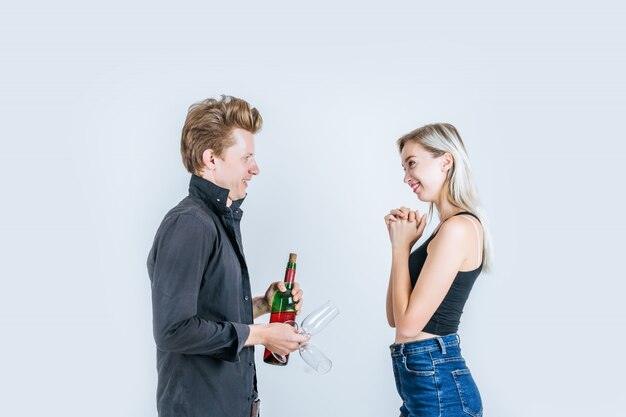 Portrait of happy young couple drinking wine 