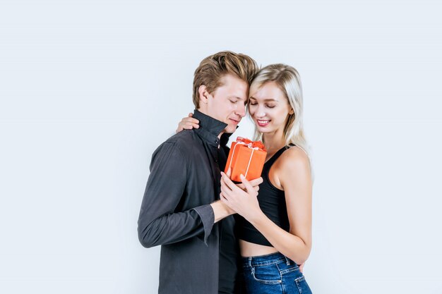 Portrait of happy young couple love together surprise with gift box 