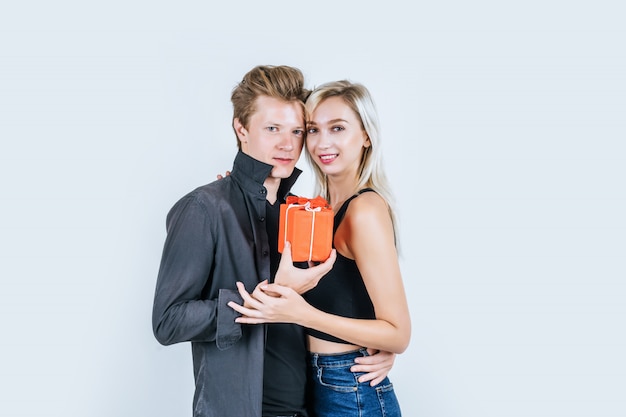 Portrait of happy young couple love together surprise with gift box 