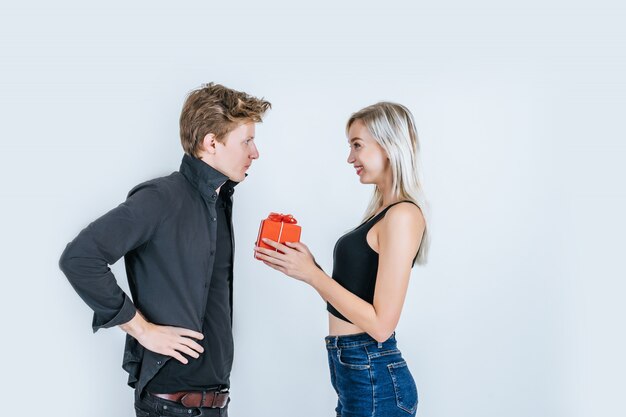 Portrait of happy young couple love together surprise with gift box 