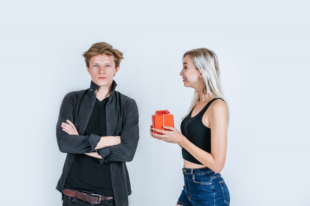 Portrait of happy young couple love together surprise with gift box 