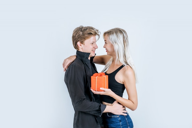 Portrait of happy young couple love together surprise with gift box 