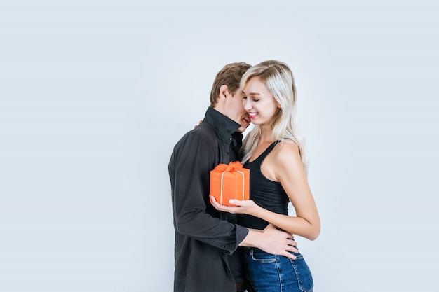 Portrait of happy young couple love together surprise with gift box 