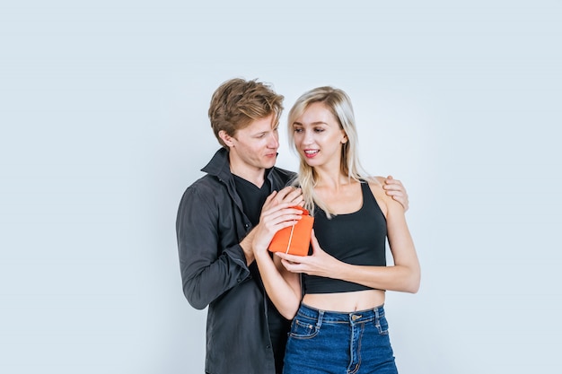 Portrait of happy young couple love together surprise with gift box 