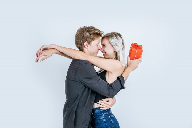 Portrait of happy young couple love together surprise with gift box 