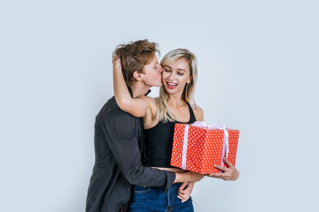 Portrait of happy young couple love together surprise with gift box 