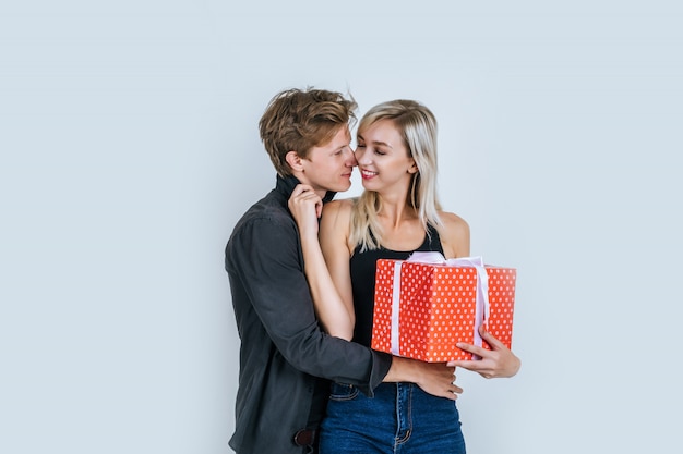 Portrait of happy young couple love together surprise with gift box 