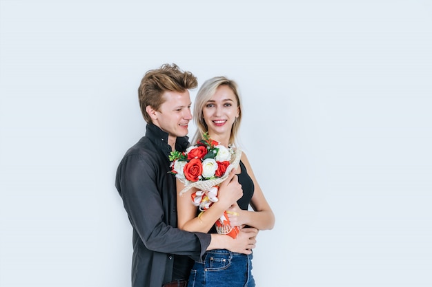 Portrait of happy young couple love together with flower 