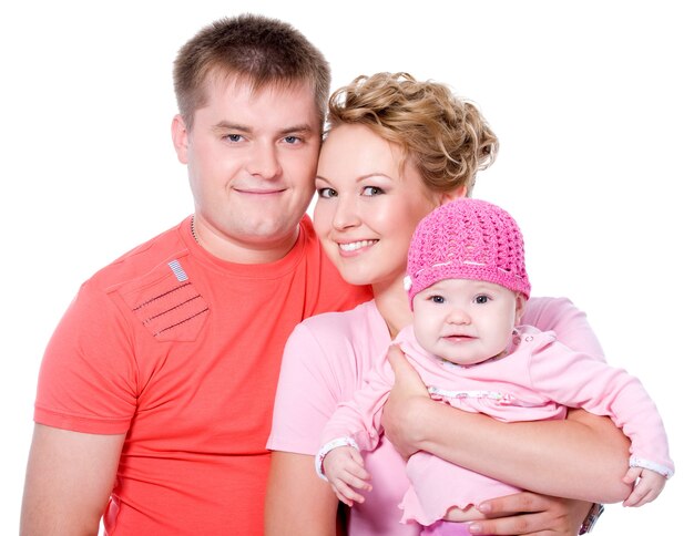 Portrait of happy young family with beautiful baby on 