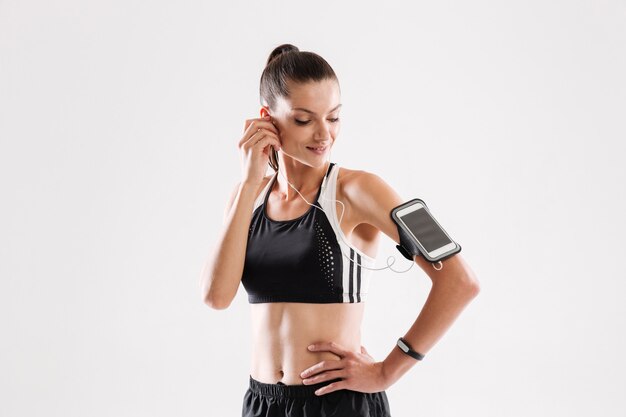 Portrait of a happy young fitness woman in sportswear