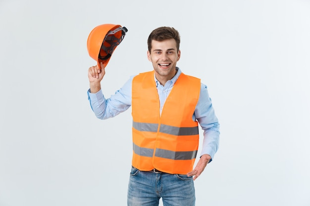 Free photo portrait of happy young foreman with orange vest isolated over white background.