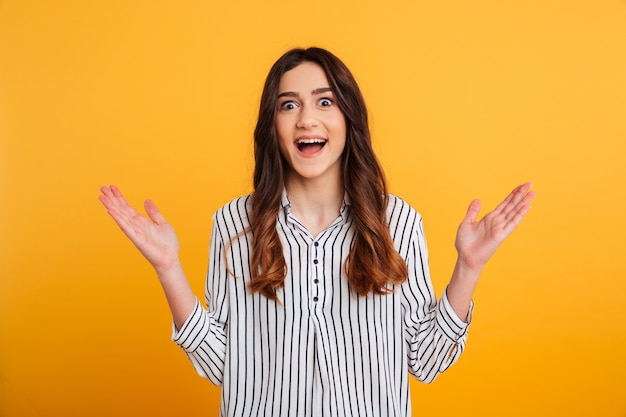 Portrait of a happy young girl celebrating success