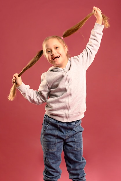 Portrait of happy young girl posing