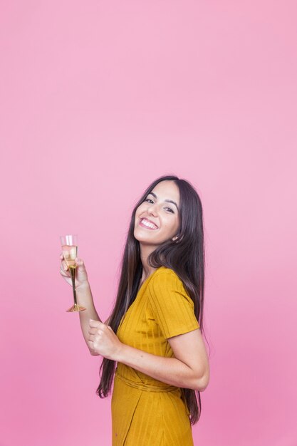 Portrait of a happy young woman with wineglass