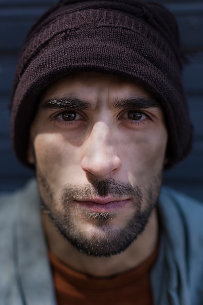 Portrait of homeless man with beautiful eyes