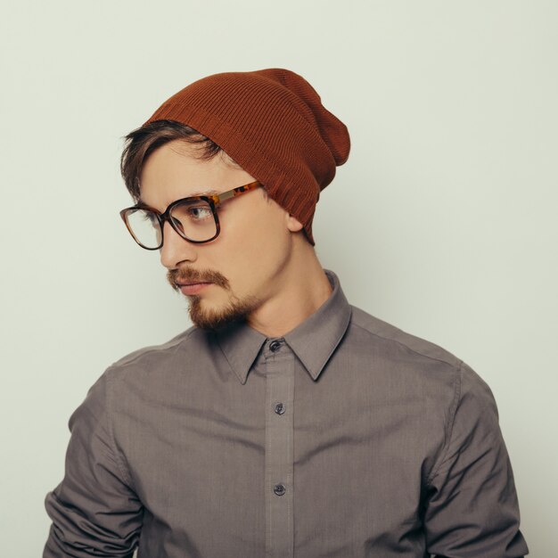 Portrait of an interesting young man in winter clothes