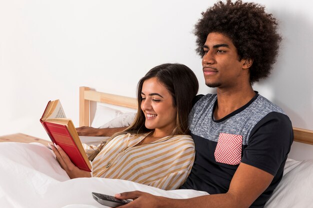 Portrait of interracial couple reading together