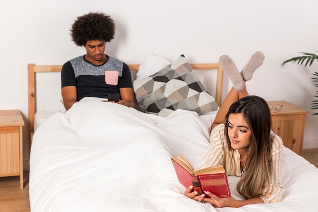 Portrait of interracial couple reading together