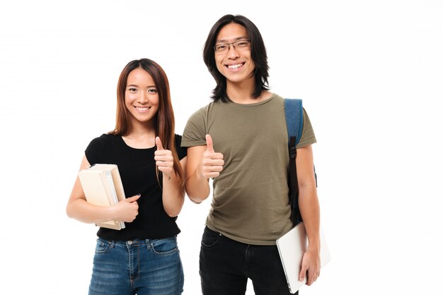 Portrait of a joyful attractive asian students couple