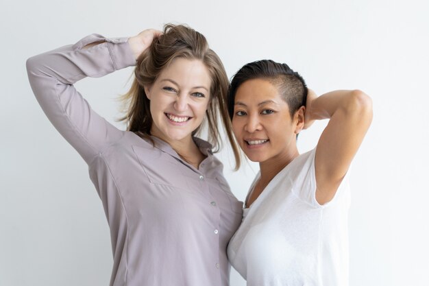 Portrait of joyful multiethnic lesbian couple