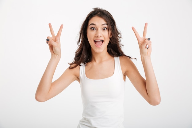 Portrait of a joyful woman dressed in tank-top