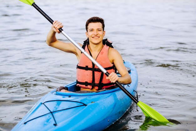 Portrait of kayak paddling on lake