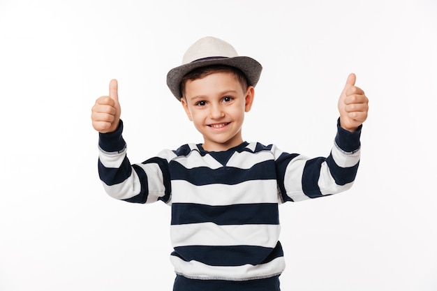 Portrait of a kid in a hat showing thumbs up