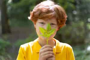 Free photo portrait of kid in the nature