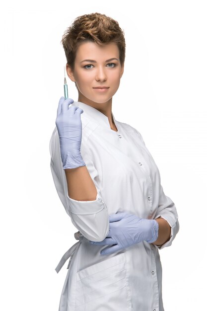 Portrait of lady surgeon showing syringe