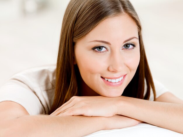 Portrait of the laughing beautiful woman at home