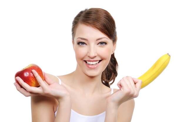 Portrait of laughing girl with fruits isolated
