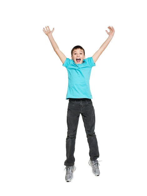 Portrait of  laughing happy teen boy jumping with raised hands up - isolated on white