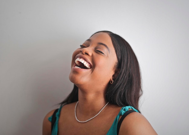 Free photo portrait of a  laughing woman