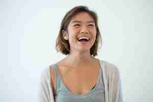 Free photo portrait of laughing young asian woman