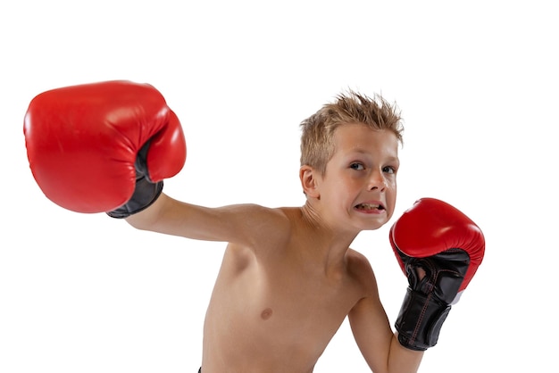 Portrait of little boy child training boxing isolated over white studio background Sportive education