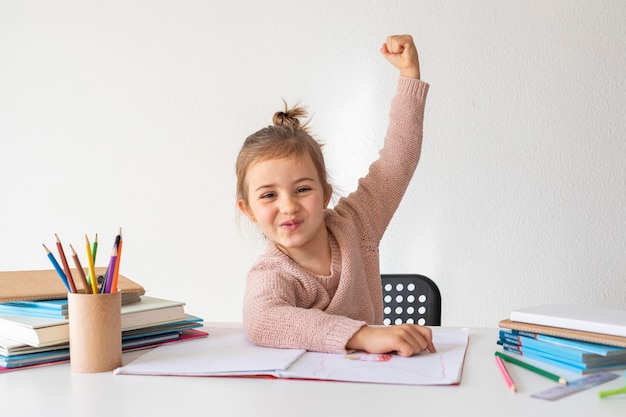 Free photo portrait little girl coloring