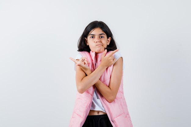 Portrait of a little girl in white t-shirt and puffer vest